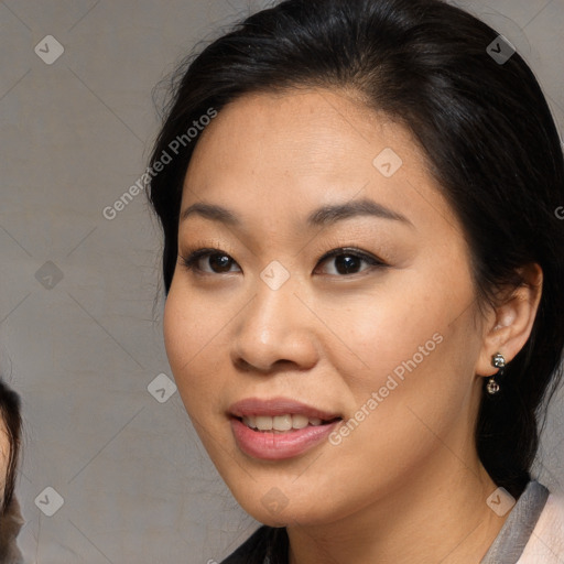 Joyful asian young-adult female with medium  brown hair and brown eyes