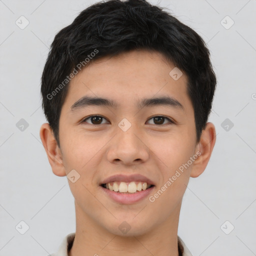 Joyful asian young-adult male with short  brown hair and brown eyes