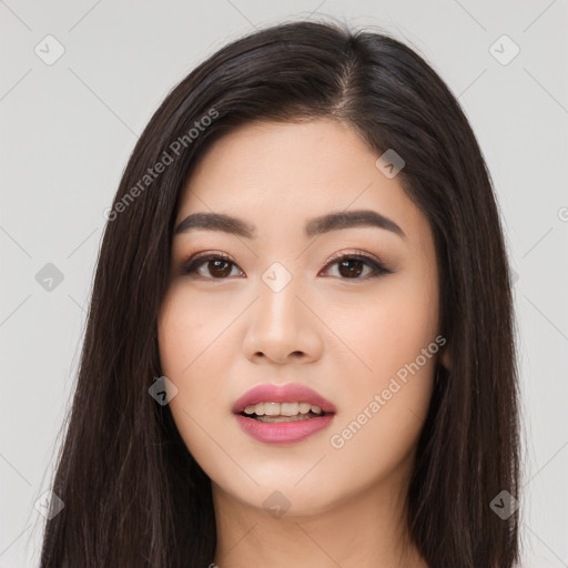 Joyful asian young-adult female with long  brown hair and brown eyes