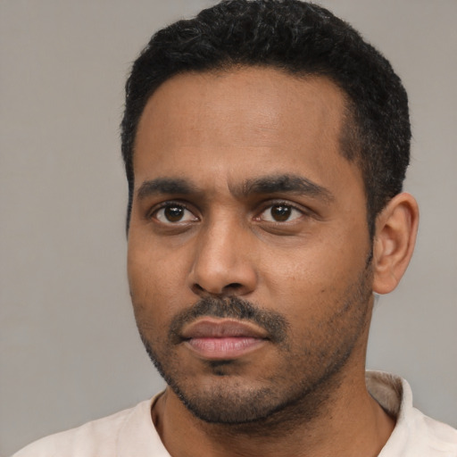 Neutral latino young-adult male with short  black hair and brown eyes