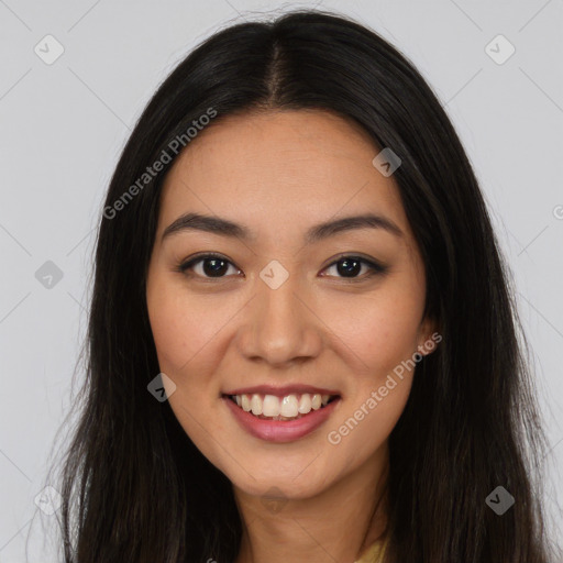 Joyful latino young-adult female with long  brown hair and brown eyes