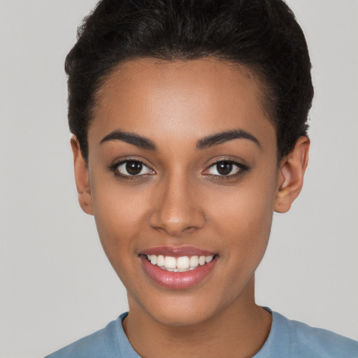 Joyful latino young-adult female with short  brown hair and brown eyes