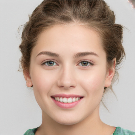 Joyful white young-adult female with medium  brown hair and green eyes