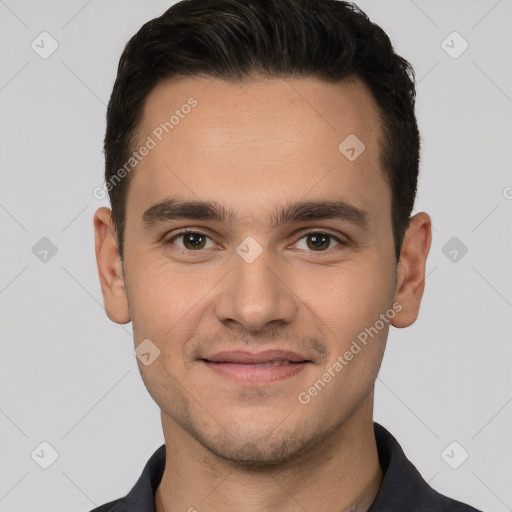 Joyful white young-adult male with short  brown hair and brown eyes