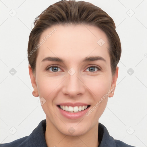 Joyful white young-adult female with short  brown hair and grey eyes