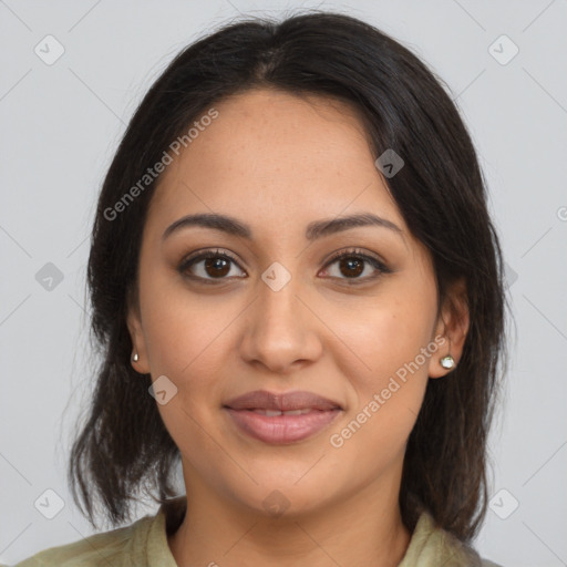 Joyful latino young-adult female with medium  brown hair and brown eyes