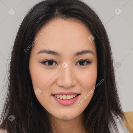 Joyful asian young-adult female with long  brown hair and brown eyes