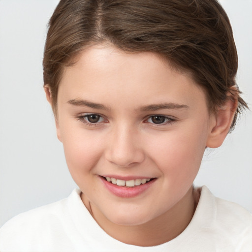 Joyful white child female with short  brown hair and brown eyes