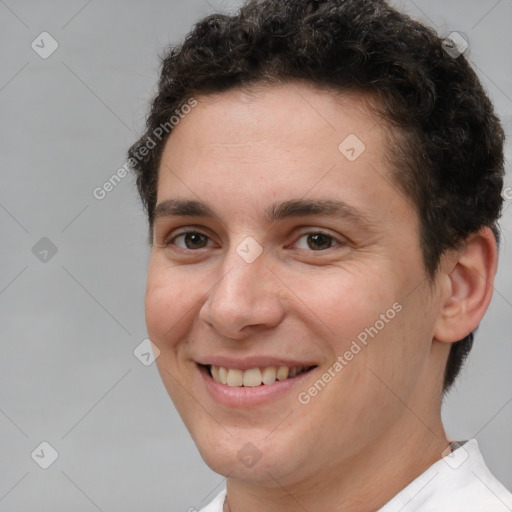 Joyful white adult male with short  brown hair and brown eyes