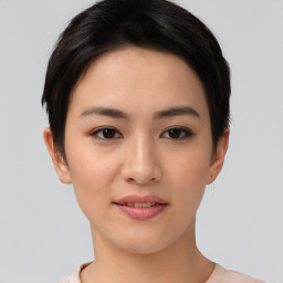 Joyful asian young-adult female with short  brown hair and brown eyes