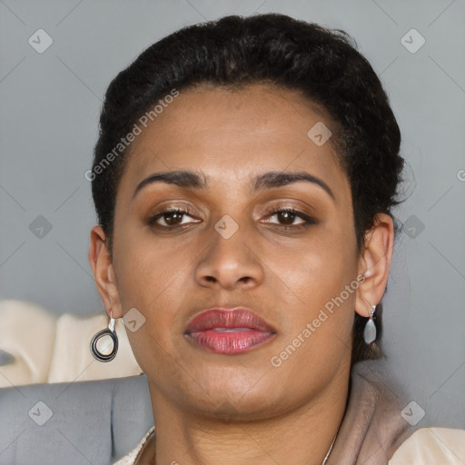 Joyful latino young-adult female with short  brown hair and brown eyes