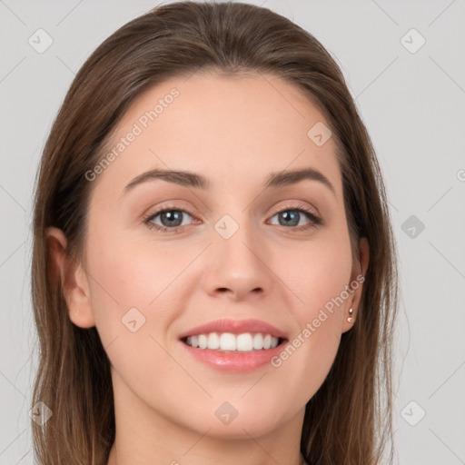 Joyful white young-adult female with long  brown hair and grey eyes