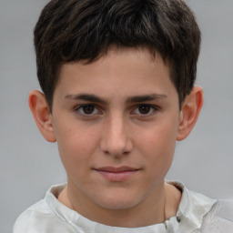 Joyful white child male with short  brown hair and brown eyes