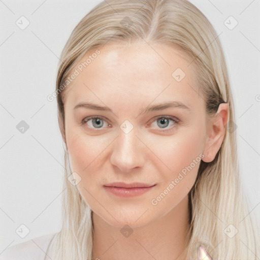 Joyful white young-adult female with long  brown hair and blue eyes