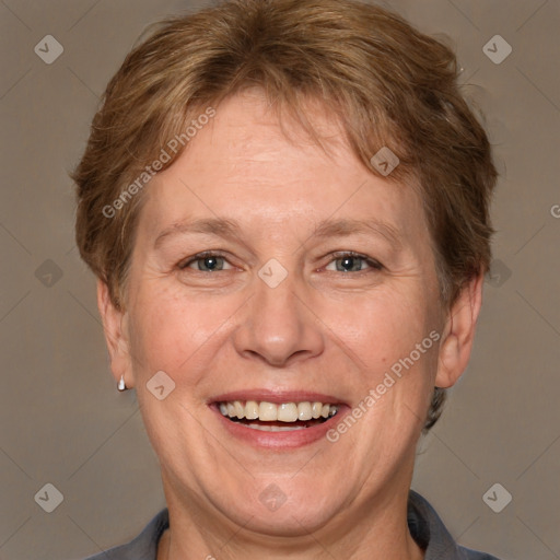 Joyful white adult female with short  brown hair and grey eyes