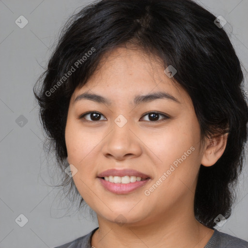 Joyful asian young-adult female with medium  black hair and brown eyes