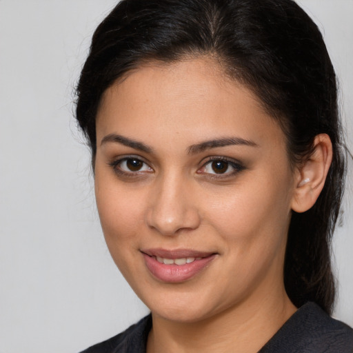 Joyful white young-adult female with medium  brown hair and brown eyes