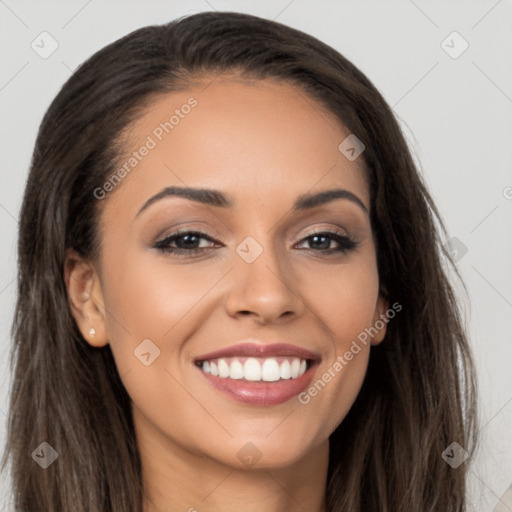 Joyful latino young-adult female with long  brown hair and brown eyes