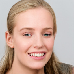 Joyful white young-adult female with long  brown hair and blue eyes