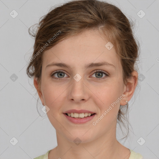 Joyful white young-adult female with medium  brown hair and green eyes