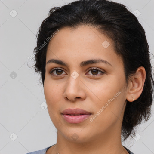 Joyful latino young-adult female with medium  brown hair and brown eyes