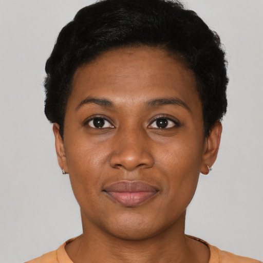 Joyful latino young-adult female with short  black hair and brown eyes