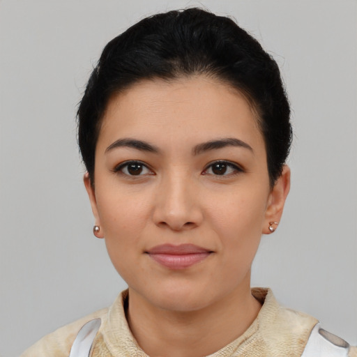 Joyful asian young-adult female with short  black hair and brown eyes