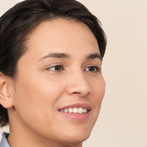 Joyful white young-adult female with medium  brown hair and brown eyes