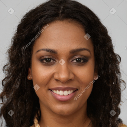 Joyful black young-adult female with long  brown hair and brown eyes