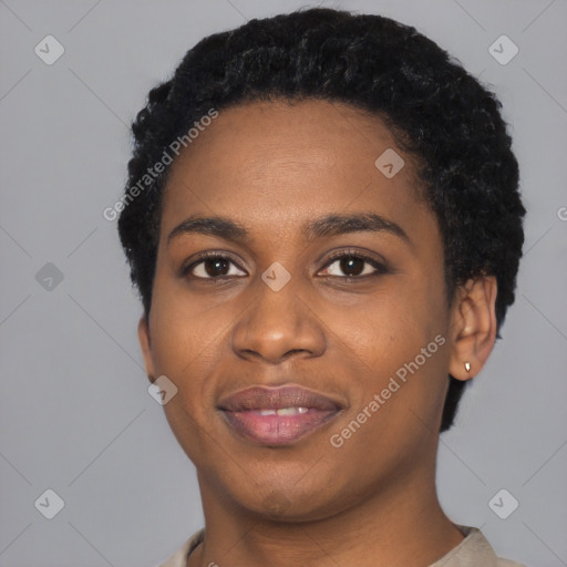Joyful black young-adult female with short  black hair and brown eyes