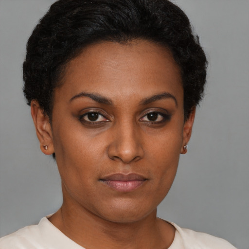 Neutral black young-adult female with short  brown hair and brown eyes