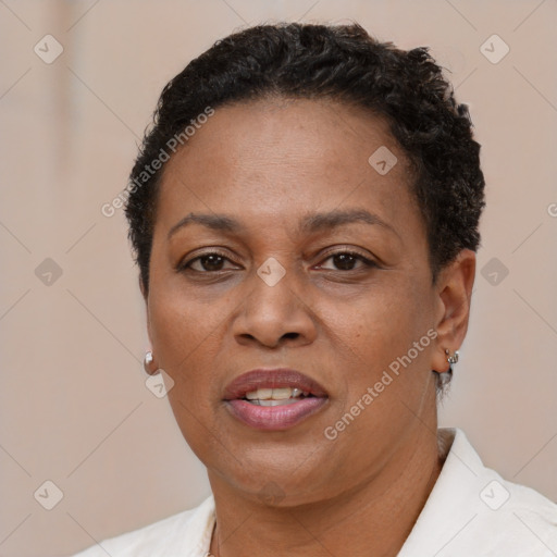 Joyful latino adult female with short  brown hair and brown eyes