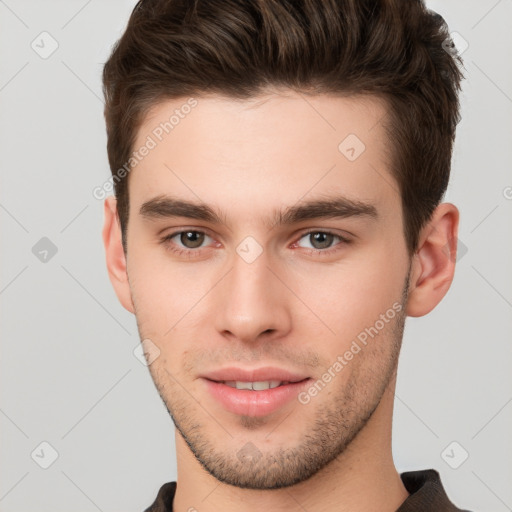 Neutral white young-adult male with short  brown hair and brown eyes