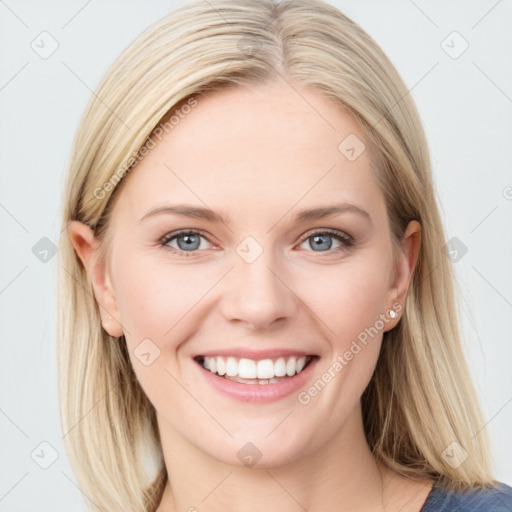 Joyful white young-adult female with medium  brown hair and blue eyes