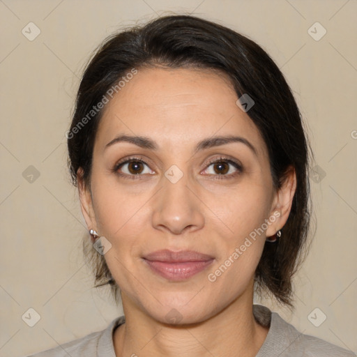 Joyful white adult female with medium  brown hair and brown eyes