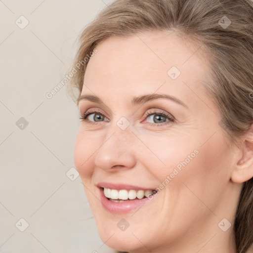 Joyful white young-adult female with medium  brown hair and blue eyes