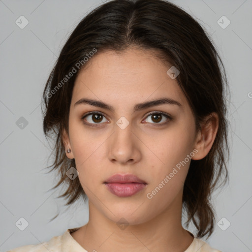 Neutral white young-adult female with medium  brown hair and brown eyes