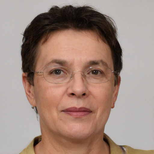 Joyful white middle-aged female with short  brown hair and grey eyes