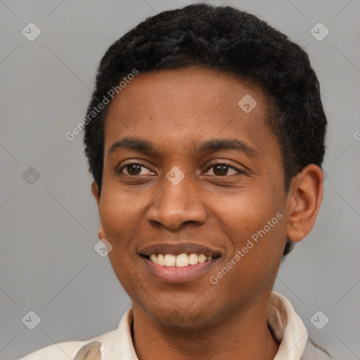 Joyful black young-adult male with short  brown hair and brown eyes