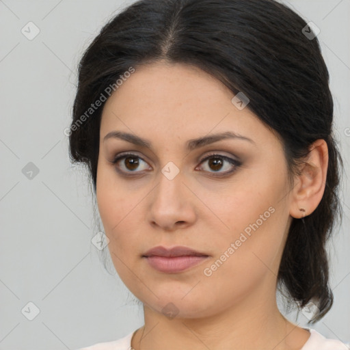 Joyful latino young-adult female with medium  brown hair and brown eyes