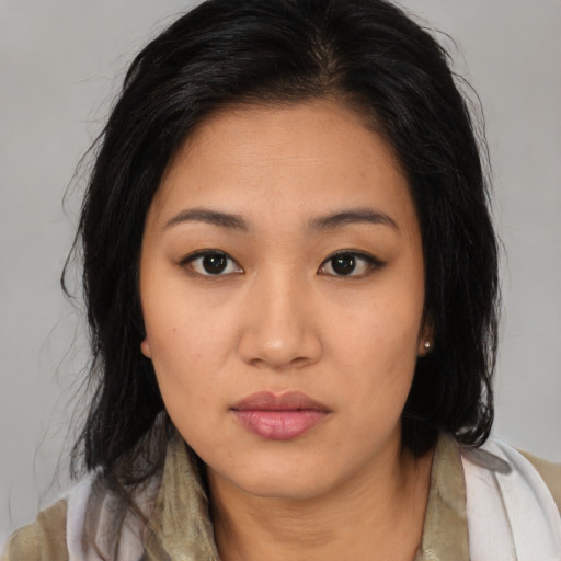 Neutral asian young-adult female with medium  brown hair and brown eyes