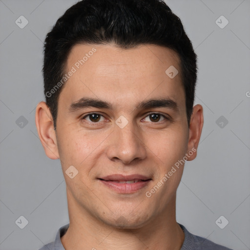 Joyful white young-adult male with short  black hair and brown eyes