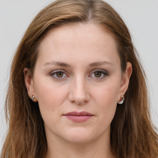 Joyful white young-adult female with long  brown hair and grey eyes