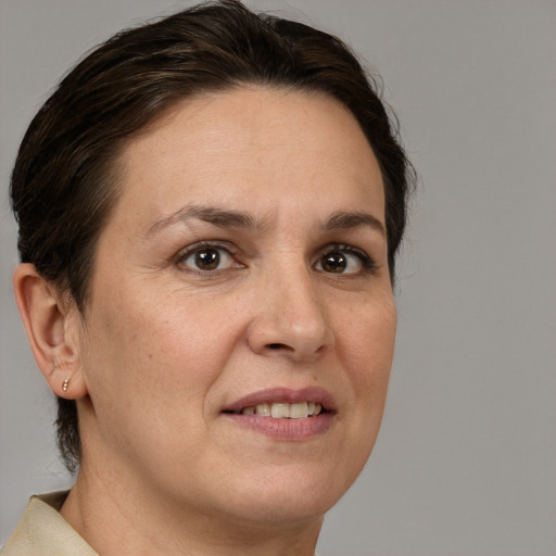 Joyful white adult female with short  brown hair and brown eyes