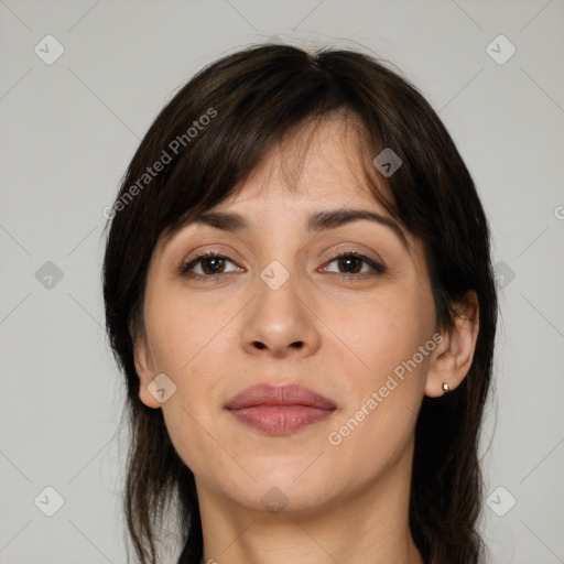 Joyful white adult female with medium  brown hair and brown eyes