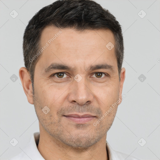 Joyful white adult male with short  brown hair and brown eyes