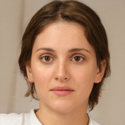 Neutral white young-adult female with medium  brown hair and brown eyes