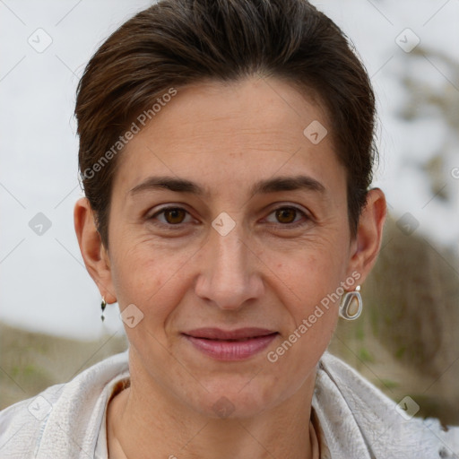 Joyful white adult female with short  brown hair and brown eyes