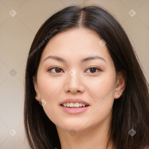 Joyful asian young-adult female with long  brown hair and brown eyes