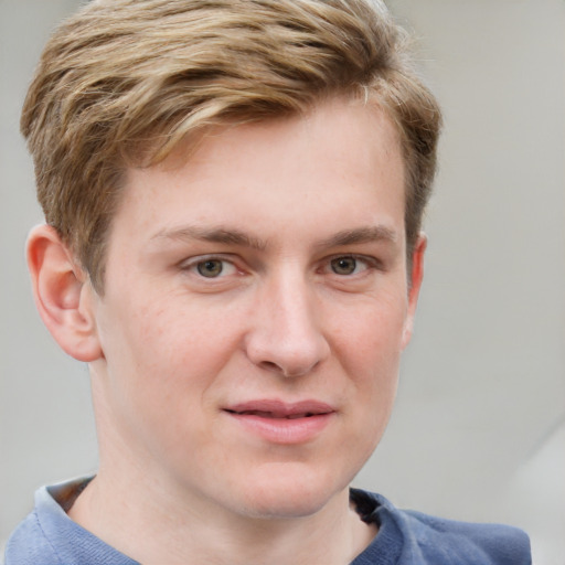 Joyful white young-adult male with short  brown hair and blue eyes